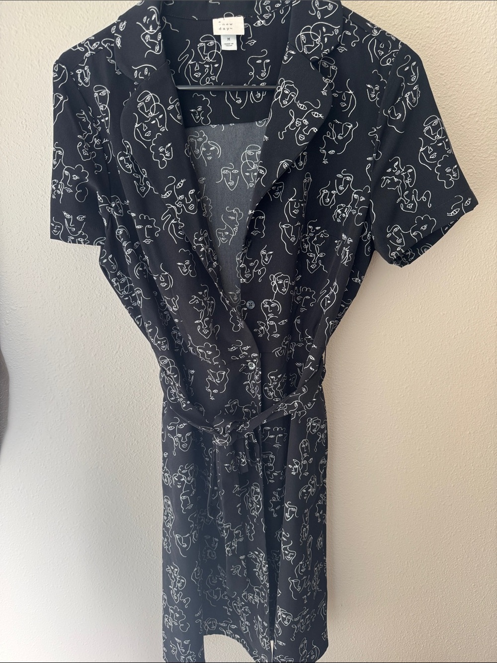 Black Short Sleeve Wrap Dress with Abstract Lady Face Print